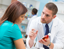 Pharmacist pharmacy patient medication adherence drug prescription CREDIT: Getty/Steve Debenport A pharmacist consulting with a patient holding medication